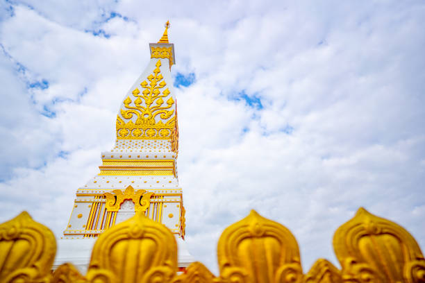 Wat Prathatphanom temple on blue sky and white cloud background, famous temple for buddist people and tourist