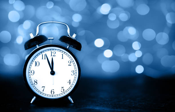 New Year's clock New Year's clock garland lights blur blue color its the final countdown stock pictures, royalty-free photos & images