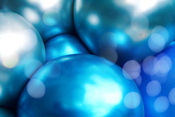 Beautiful festive background with great balloons. Helium blue and grey party balloons gathered together. Soft selective focus.