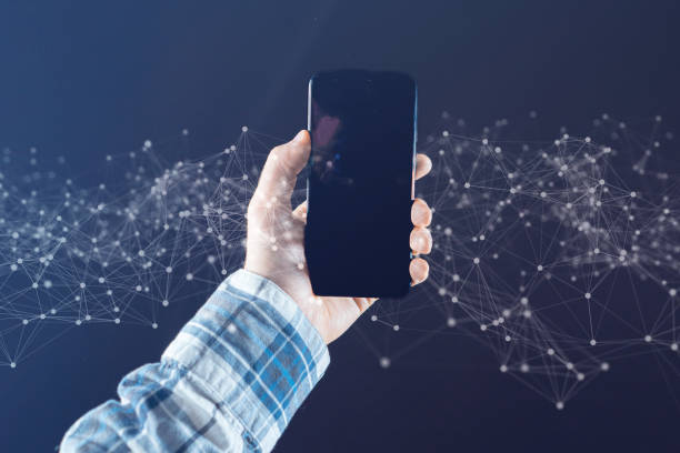 istock hand holding an abstract smartphone with connection lines 1192527147