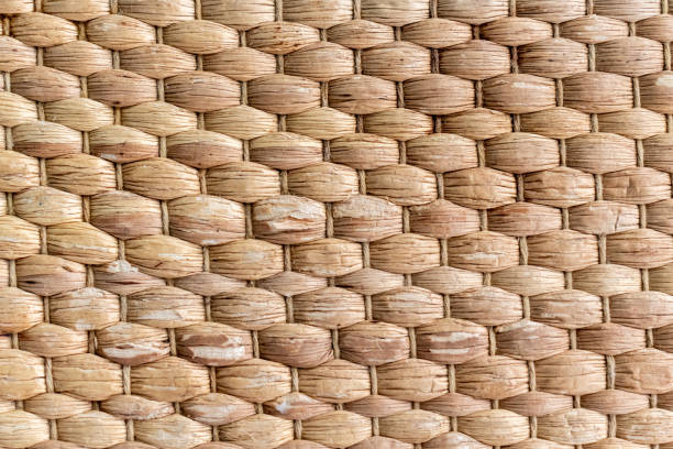 istock Beige brown wicker straw background, wicker straw mat texture closeup 1192527986