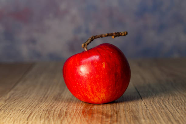 istock Beautiful red apple lies on the table 1192528017