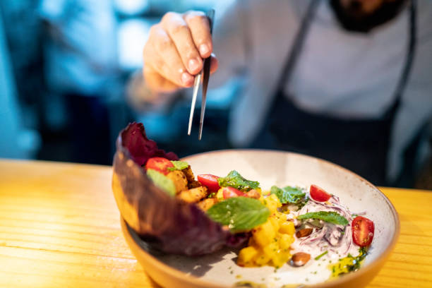 istock Close-up of chef preparing a dish 1192528148