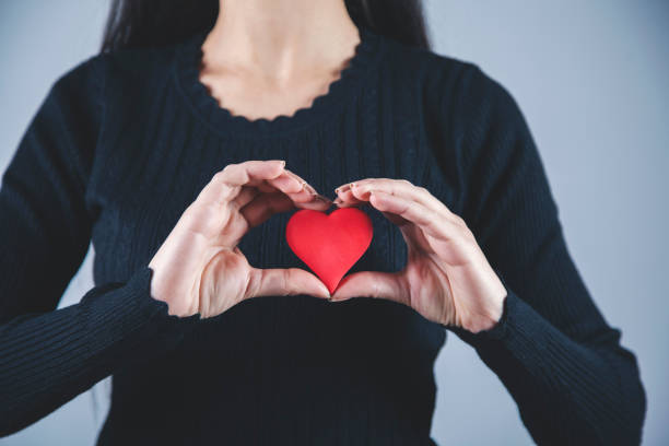 istock woman hand red heart 1192529007