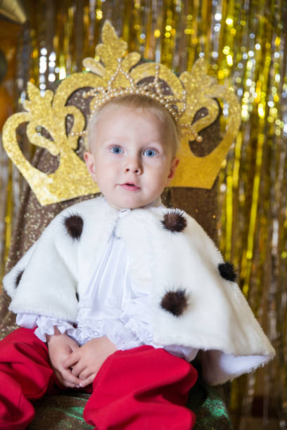 istock Little prince in the crown and mantle 1192529465