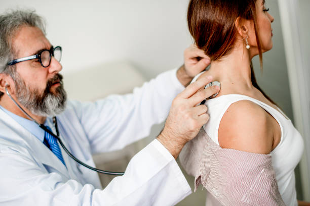 istock Young woman getting examined by a doctor. 1192532774