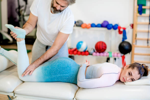 istock Young woman in physical therapy 1192532927