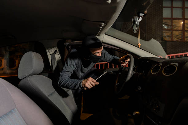 istock Thief is Trying to Hijack the Car During a Night 1192533872