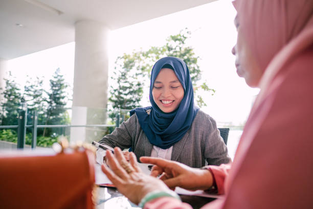 istock Young Muslim Women Insurance Agent with Client 1192533877