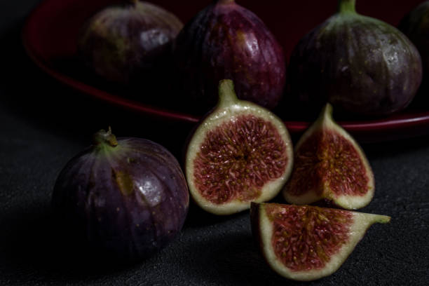 istock fresh figs close-up on black background 1192535161