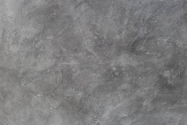 istock Texture of a grey stone background. Dark Cement and concrete texture 1192538808