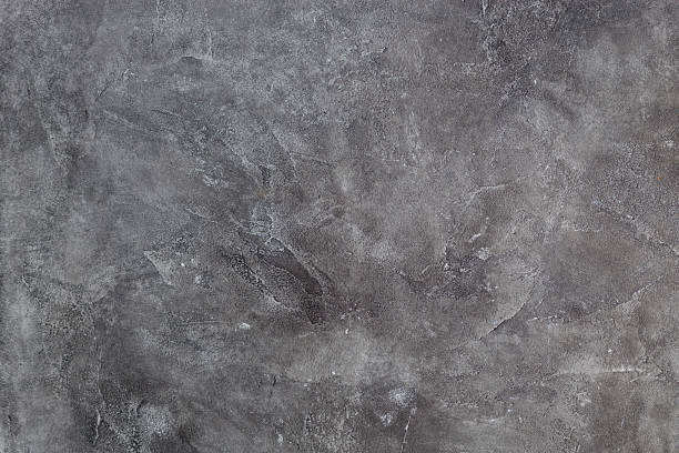 istock Texture of a grey stone background. Dark Cement and concrete texture 1192538834