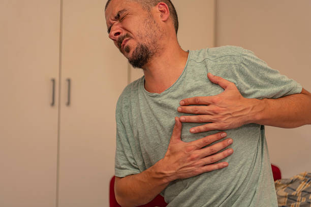 istock Man is Suffering from a Serious Pain in Chest 1192540432