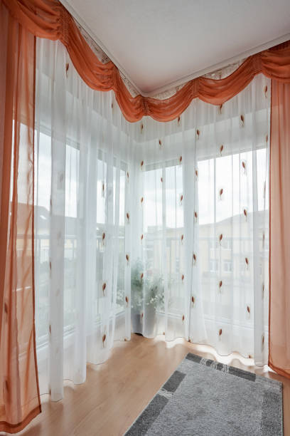 istock Beautiful corner window to the floor with a curtain 1192544510