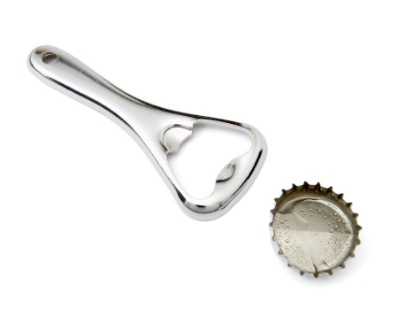 Rusty bottle opener against a white background