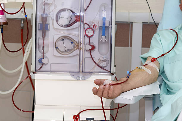 Hemodialysis machine with a patient patient at haemodialysis   dialysis stock pictures, royalty-free photos & images