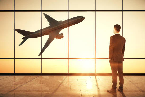 istock Businessman in creative airport interior 1192557405