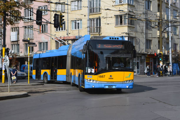 Modern trolleybus on a street Sofia, Bulgaria - 26th September, 2019: Trolleybus Škoda 27Tr Solaris driving on a street. This model is one of the most popular trolleybuses in Europe. trolley bus stock pictures, royalty-free photos & images