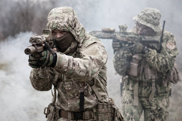 istock military soldiers attacking enemies trough smoke screen 1192563421