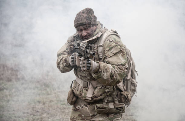 istock army soldier attacking enemies trough smoke screen 1192563458