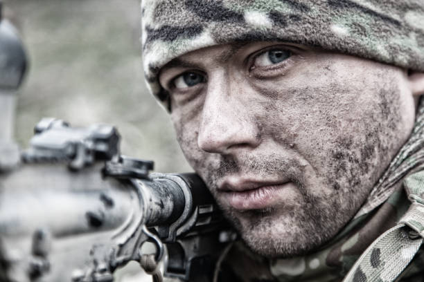 istock Army soldier infantryman shooting with service rifle 1192563485