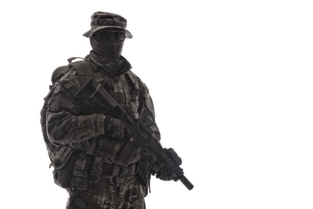 istock Army infantryman aiming service rifle studio shoot 1192564616