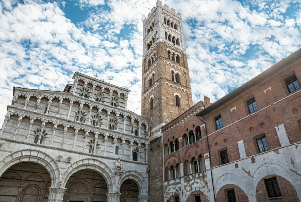 Romanesque Facade and bell tower of St. Martin Cathedral in Lucca, Tuscany. It contains most precious relic in Lucca, Holy Face of LuccaRomanesque Facade and bell tower of St. Martin Cathedral in Lucca, Tuscany. It contains most precious relic in Lucca, Holy Face of Lucca fachada románica y campanario de la catedral de san martín en lucca, toscana. contiene la reliquia más preciada de lucca, la cara santa de luccafachada románica y el campanario de la catedral de san martín en lucca, toscana. contiene la reliquia más