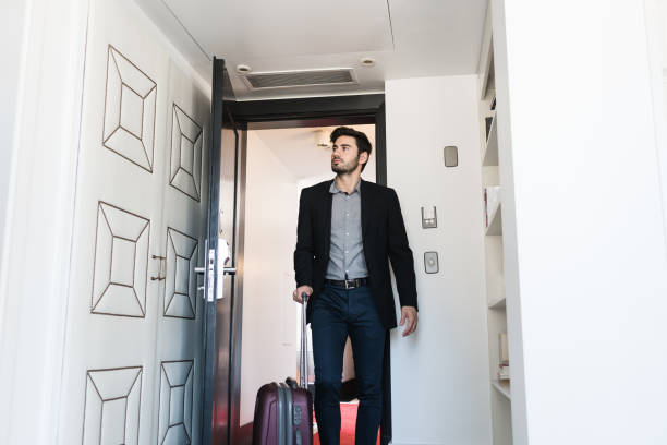 istock businessman arriving at hotel room 1192566742