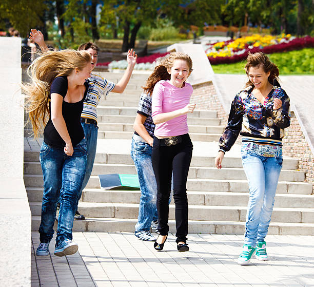 istock Happy teenagers running 119257497