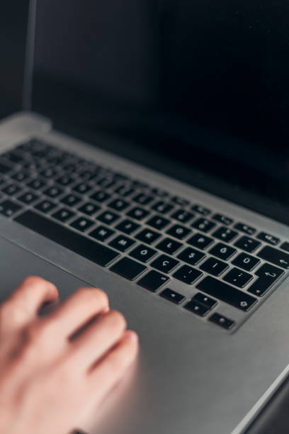 istock Woman hand using and touching laptop touchpad 1192577221