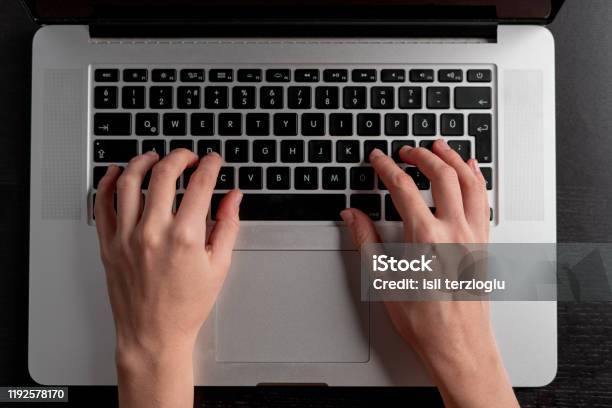 Closeup Of Woman Hand Typing On Laptop Keyboard Stock Photo - Download Image Now - Hand, Typing, Adult