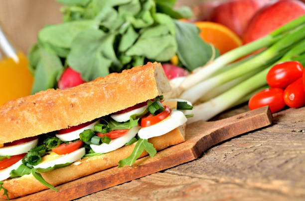 istock Bread sandwich with egg, arugula salad, tomatoes and radish 1192578806
