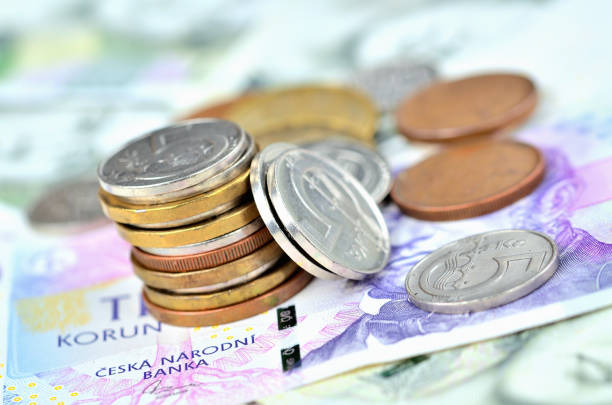 istock Pile of different Czech coins on banknotes 1192578839