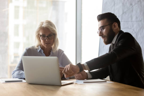 istock Multiethnic businesspeople talk collaborating at meeting in office 1192578955