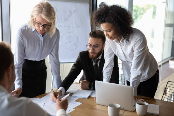 istock Diverse colleagues brainstorm considering company project together 1192579004