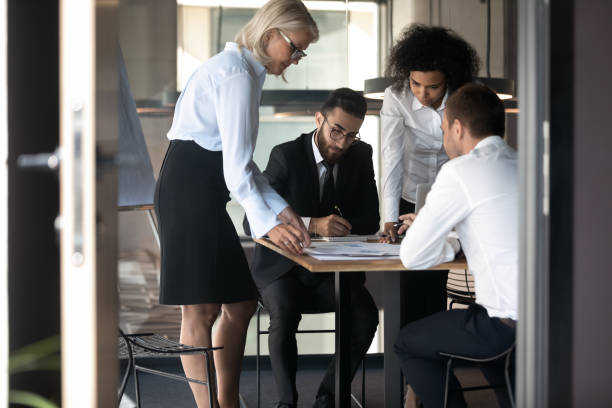 istock Multiethnic businesspeople brainstorm considering ideas in office 1192579007