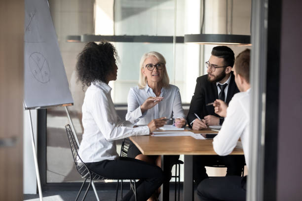 istock Diverse multiethnic colleagues talk brainstorming at office meeting 1192579010