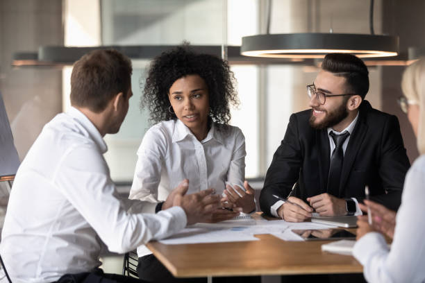 istock Multiethnic colleagues brainstorm discussing ideas at meeting 1192579021