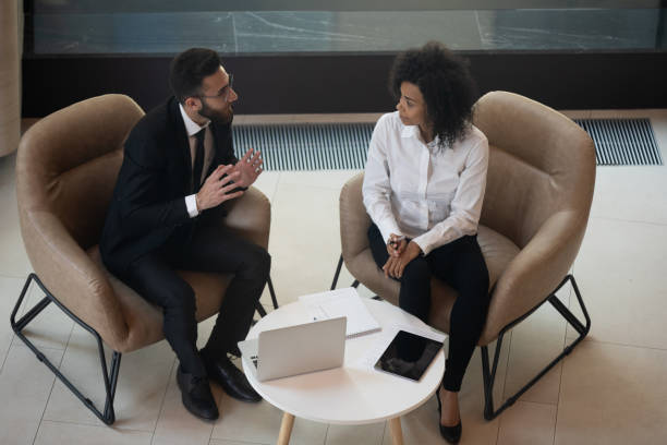 istock Top view of multiethnic colleagues discuss in office 1192579024
