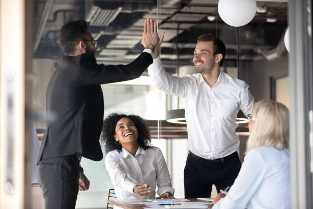 istock Excited male colleagues give high five celebrating shared success 1192579029