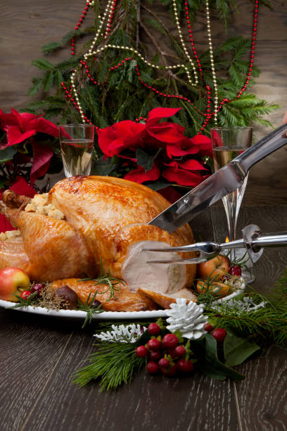 istock Carving Roasted Christmas Turkey with Grab Apples 1192581480