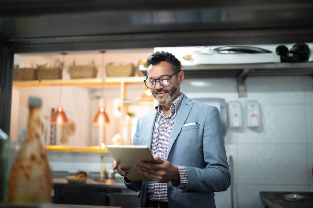 Businessman/owner checking kitchen supplies