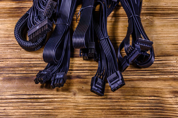 istock Set of computer psu cables on a wooden background 1192584374