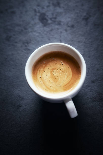 istock Cup of coffee on black background. Copy space. 1192584402