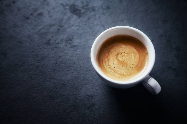istock Cup of coffee on black background. Copy space. 1192585373