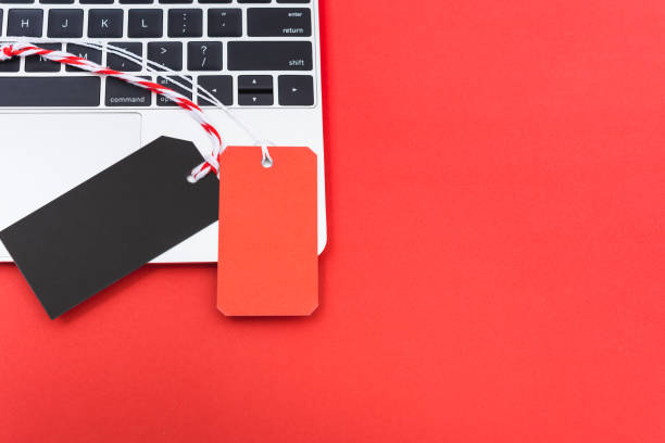 istock Blank red tag label and black tag label shopping concept on laptop computer 1192596912