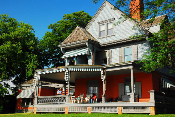 Oyster Bay, NY, USA June 30, 2009 A family gathers on the parch of Sagamore Hill, the former home of US President Theodore Roosevelt