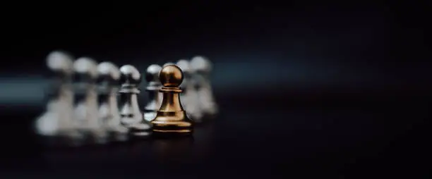 Gold pawn of chess. Unique, Think different, Individual and standing out from the crowd concept. Panoramic image