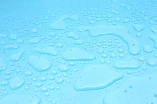 istock Close up water drops on blue background, Water drop in macro photography 1192605421