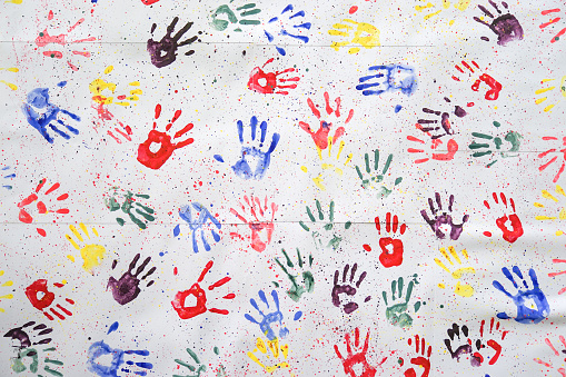 colorful hand prints. Kids colorful hand prints on the wall for color art background